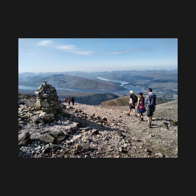 Hikers pass a navigation cairn as they descend back down Ben Nevis by richflintphoto