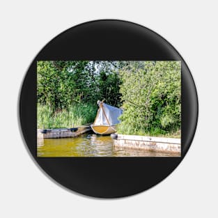 Wooden boat moored in the Norfolk Broads Pin