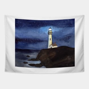 Lighthouse on a cliff at night time Tapestry