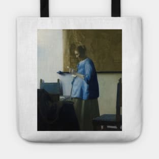 Woman in Blue Reading a Letter - Johannes Vermeer Tote