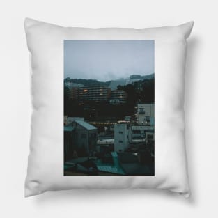 Ito at Dusk with cloud filled mountains in the background Pillow