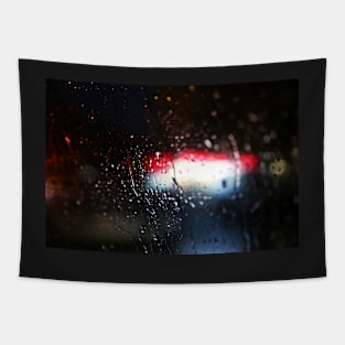 Deatil of raindrops on a car windshield at night Tapestry