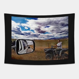 Canadian cowboy herder riding atv Alberta, Canada. Tapestry