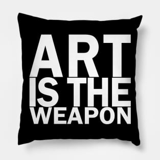 Art is the weapon. (In white) Pillow