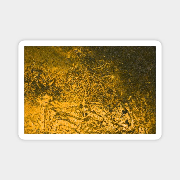 Beautiful golden paint effect on rough surface. Magnet by textural