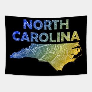 Colorful mandala art map of North Carolina with text in blue and yellow Tapestry