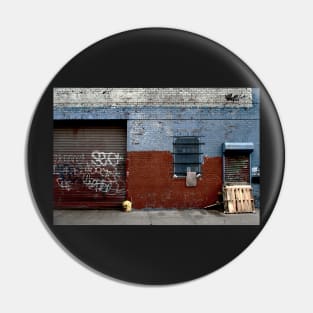 View of brick wall with spray paint in urban street in New York City Pin