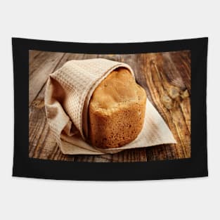 Homemade bread on a wooden board Tapestry