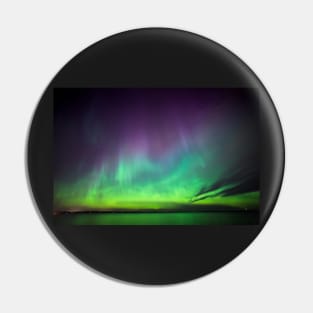 Beautiful northern lights over lake in Finland Pin