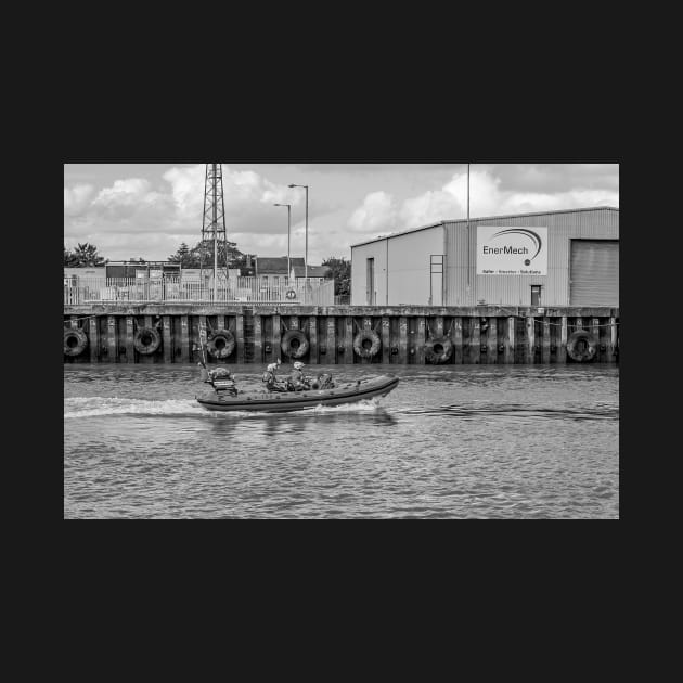 Inshore RNLI lifeboat crew motoring up the River Yare by yackers1