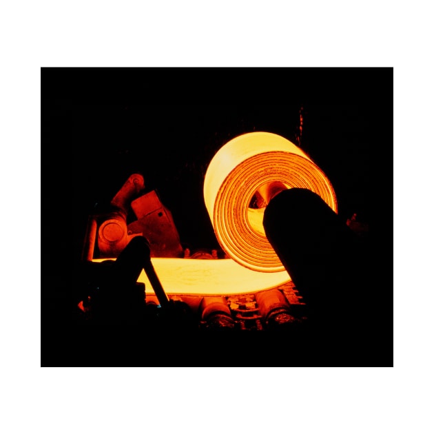 Red-hot coil of sheet steel in a rolling mill. (T810/0142) by SciencePhoto