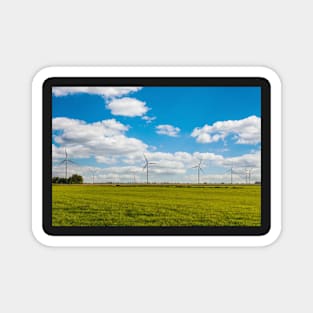 Windmill farm on green meadow Magnet