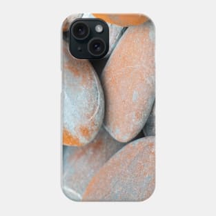 Beach stones in grey with orange coloured lichen growth Phone Case