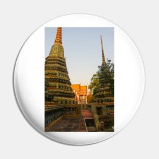 First sidewalk view to ornate roof, flanked from parts of Chedis at Wat Pho. Pin