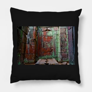 In an old Angkor temple with walls colored by nature. Pillow