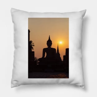 Buddha statue against sunset silhouette Pillow