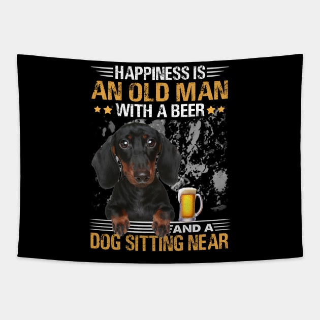 Happiness Is An Old Man With A Beer And A Dachshund Sitting Near Tapestry by Magazine