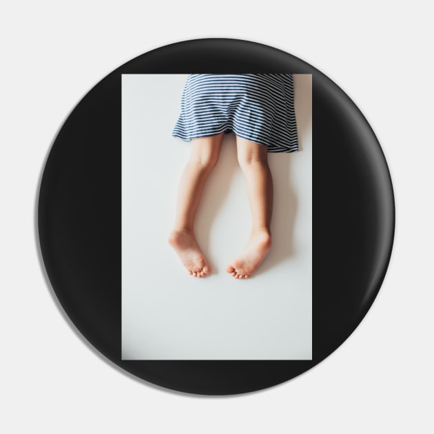 Legs of Small Girl Lying on White Tabletop Pin by visualspectrum