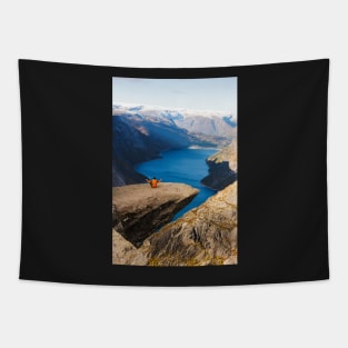 Man sitting on Trolltunga rock meditating Tapestry