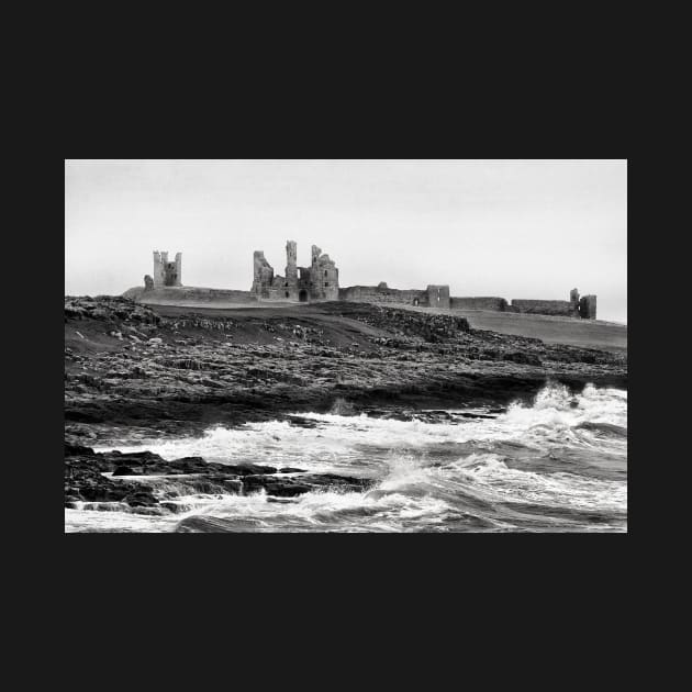 Waves along the rocky coast near Dunstanburgh Castle, Northumberland, UK by richflintphoto