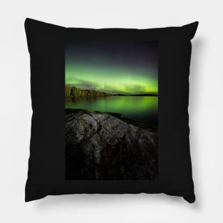 Northern lights glowing over lake in Finland Pillow