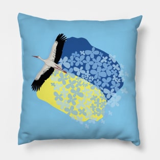 A Stork carries a Ukrainian flag and wildflowers on its wings Pillow