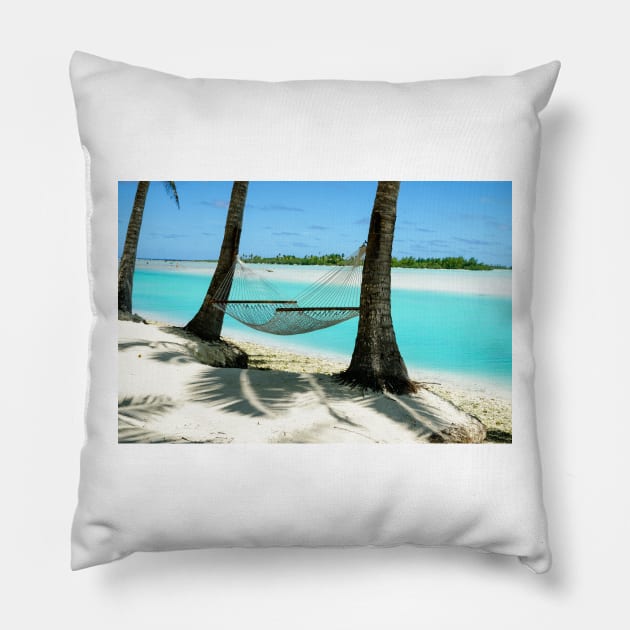 Empty hammock between two tropical palm trees in Cook Islands. Pillow by brians101