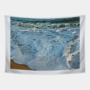 Waves hitting the sand beach Tapestry