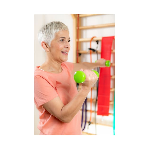 Senior woman exercising with dumbbells (F024/9971) by SciencePhoto