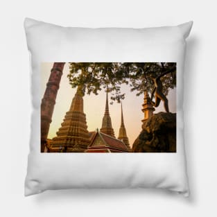 Mosaic tiled Buddha stupas and an iron sculpture at Wat Pho temple. Pillow