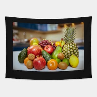 Exotic fruits on the table in the kitchen Tapestry