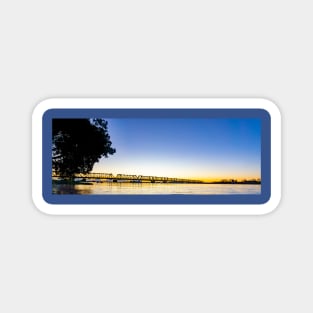 Tauranga's historic railway bridge panorama silhouetted by golden sunrise Magnet