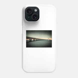 In the colorful evening light lies the Öresund Bridge, which connects Sweden and Denmark Phone Case