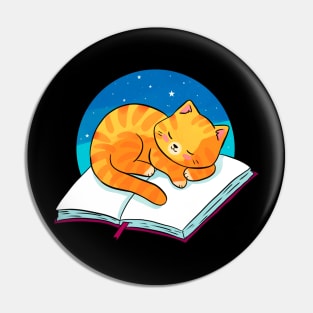 Cute ginger cat sleeping on a book Pin