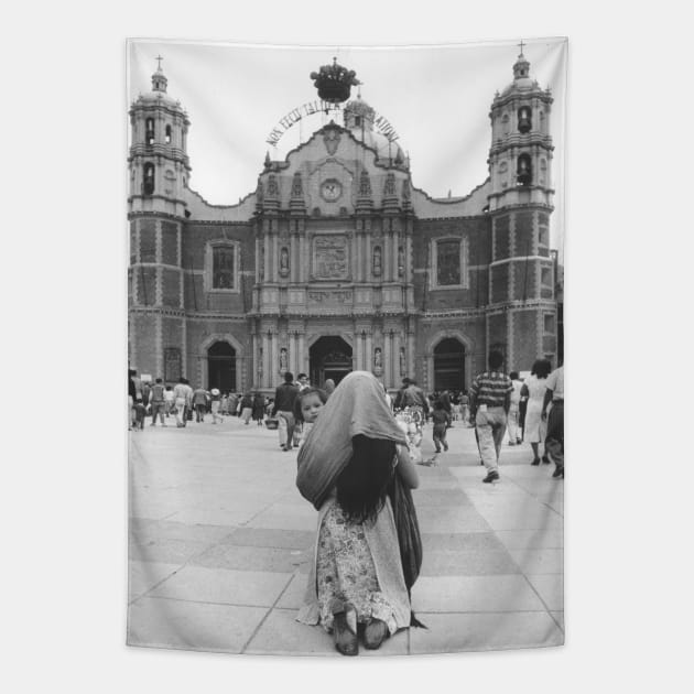 Woman Praying in front of Our Lady of Guadalupe Tapestry by In Memory of Jerry Frank