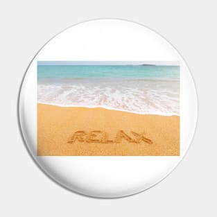 Inscription "RELAX" made on beautiful beach by the blue sea Pin