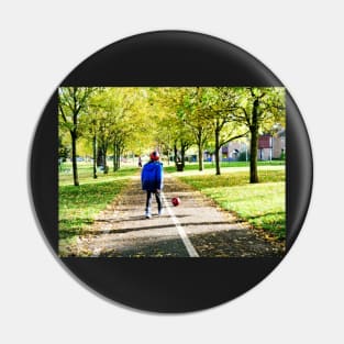 Boy playing football in autumn Pin