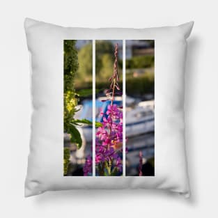 Wonderful landscapes in Norway. Blooming colorful lupine flower in Norway in the wild grass. Blur harbour background with boats. Summer sunny day (vertical) Pillow