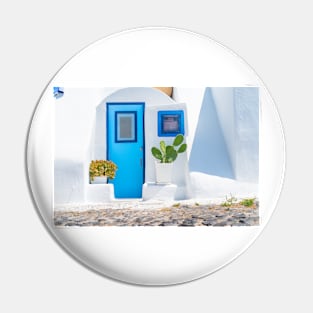 White exterior Mediterranean style entrance with blue door Pin