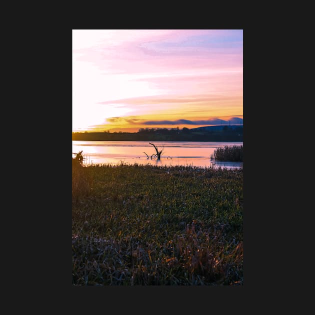 Frozen Scottish lake at sunset on a winter afternoon - portrait by chiaravisuals