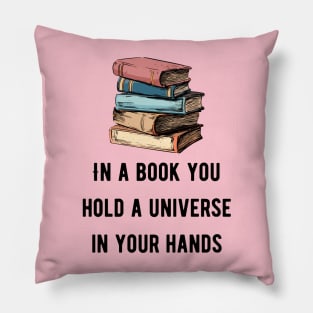 In a book you hold a universe in your hands pink Pillow