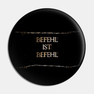 Befehl ist Befehl or Superior Orders text on black background lined with barbed wire Pin