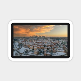 Warsaw old town, snow-covered roofs and and distant city center at dusk Magnet