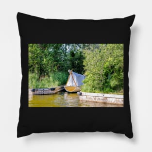 Wooden boat moored in the Norfolk Broads Pillow