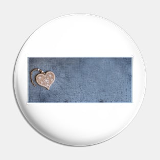 Brown heart pendant on grey surface Pin