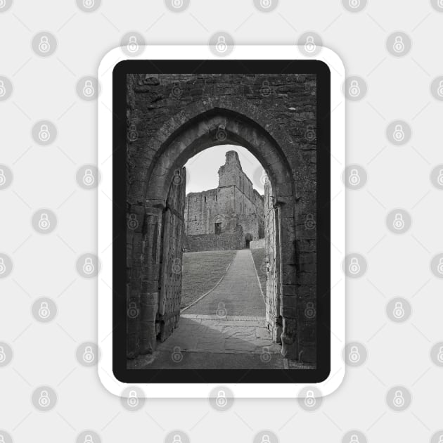 An ancient gateway in Chepstow castle offers views of the interior courtyard. Magnet by Graz-Photos