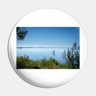 a lone board sailor in the quiet bay in the southern Öresund, on the Swedish side - SUP stand up paddle board Pin