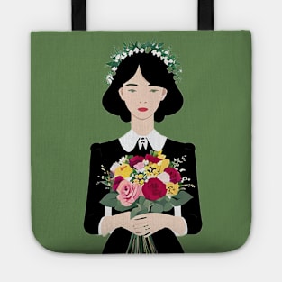 Young woman holding a bouquet of flowers Tote