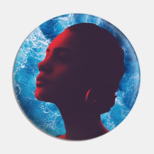 a red silhouette of a proud woman in the ocean Pin