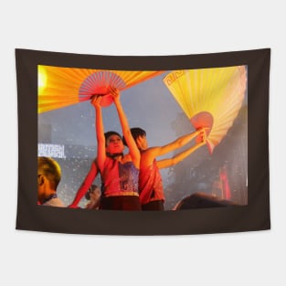 Dance performer raising arms with paper fans Tapestry